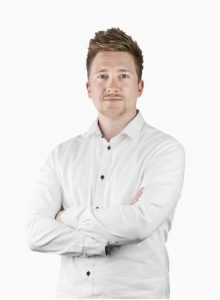 Man in a white shirt standing in front of a white background